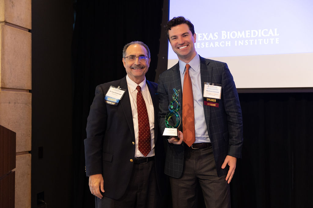 Dr. Larry Schlesinger presenting the Stand4Science Award to Matthew Crommett, accepting on behalf of Lyda Hill Philanthropies