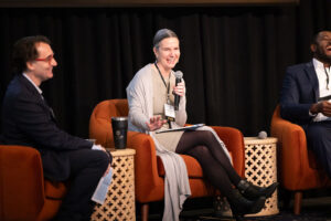 Dr. Barbara Taylor laughs with Dr. Jordi Torrelles and Dr. Marcel Yotebieng