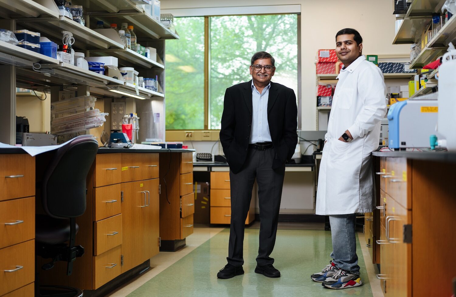 Deepak Kaushal in his lab with Dhiraj Singh