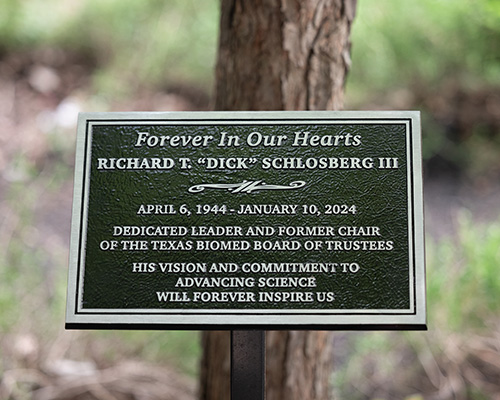 Placard commemorating the passing of Richard T. “Dick” Schlosberg III