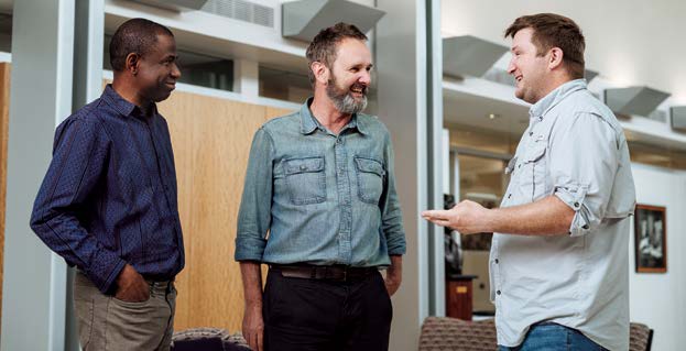 Dr. Enabulele and Dr. Platt talk with their principal investigator, Professor Tim Anderson, Ph.D., (center) who notes that this project looking at zoonotic pathogens that may be all around us was conceived before the COVID-19 pandemic began.